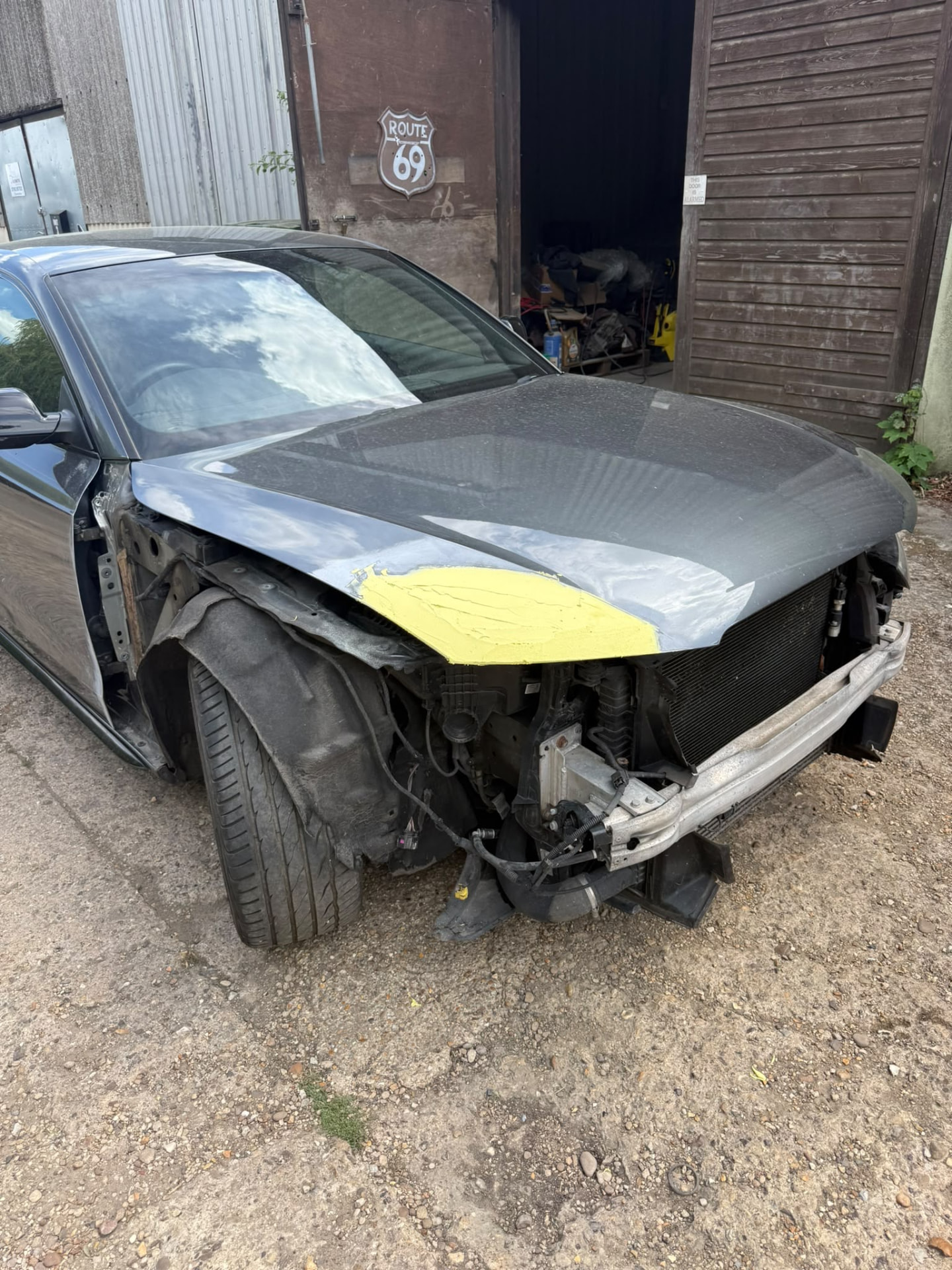 Before 5 — Audi bodywork shown through damage repair, preparation, masking, primer and paintwork.