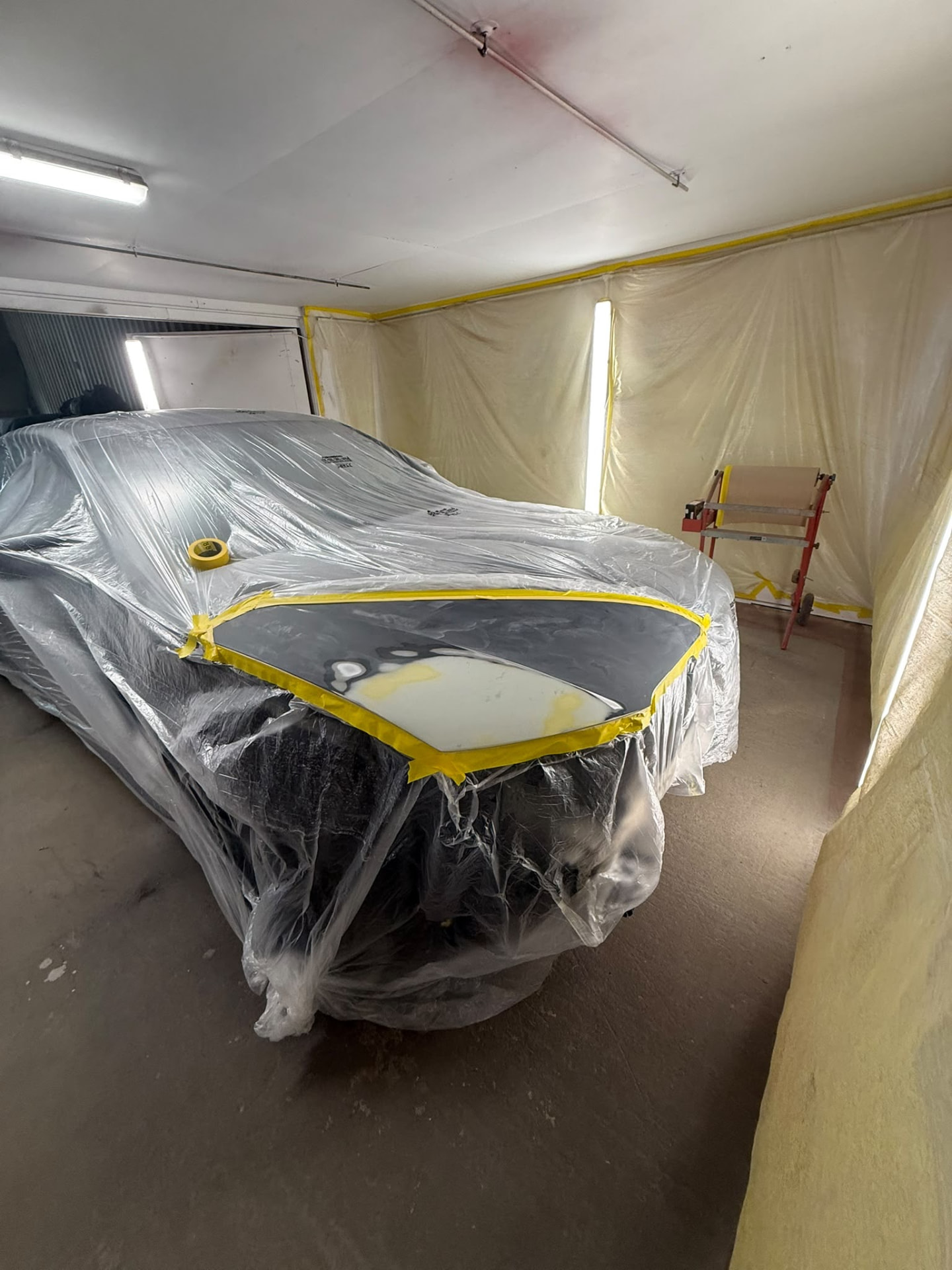 Before 6 — Audi bodywork shown through damage repair, preparation, masking, primer and paintwork.