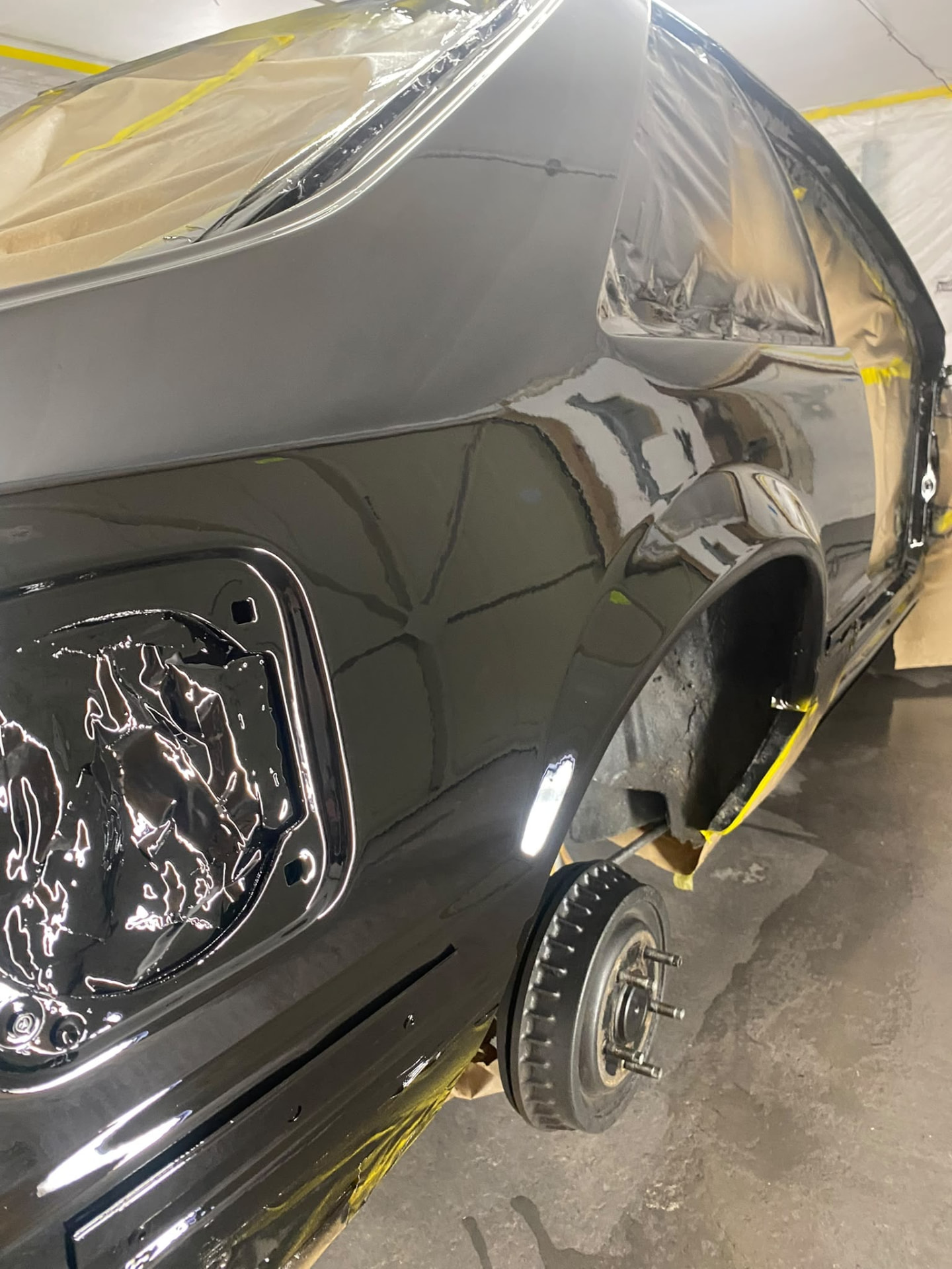 After — Stripped back to bare panels and prepared in primer, then refinished to a gloss black show-quality shine.
