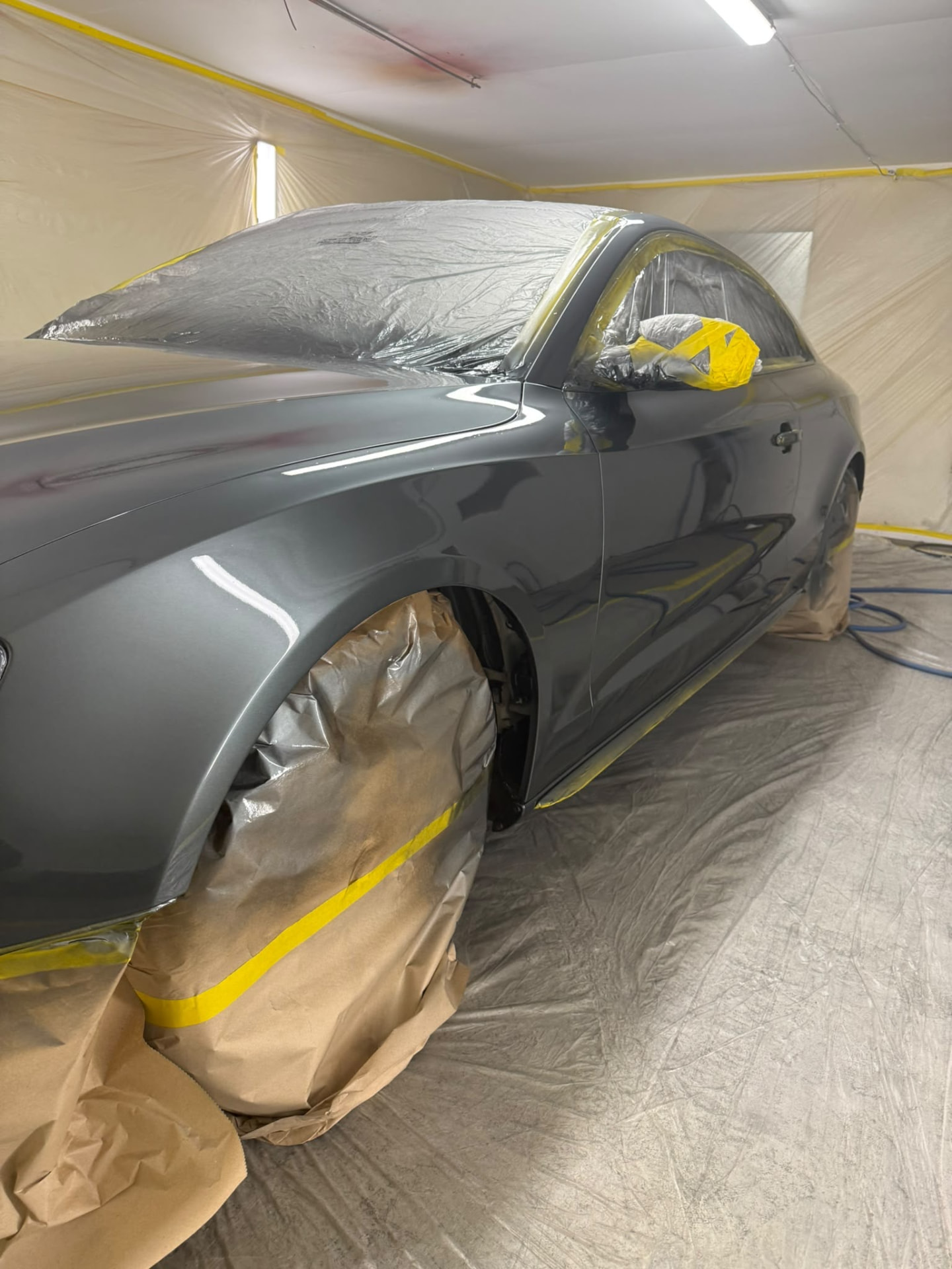 After — Audi bodywork shown through damage repair, preparation, masking, primer and paintwork.