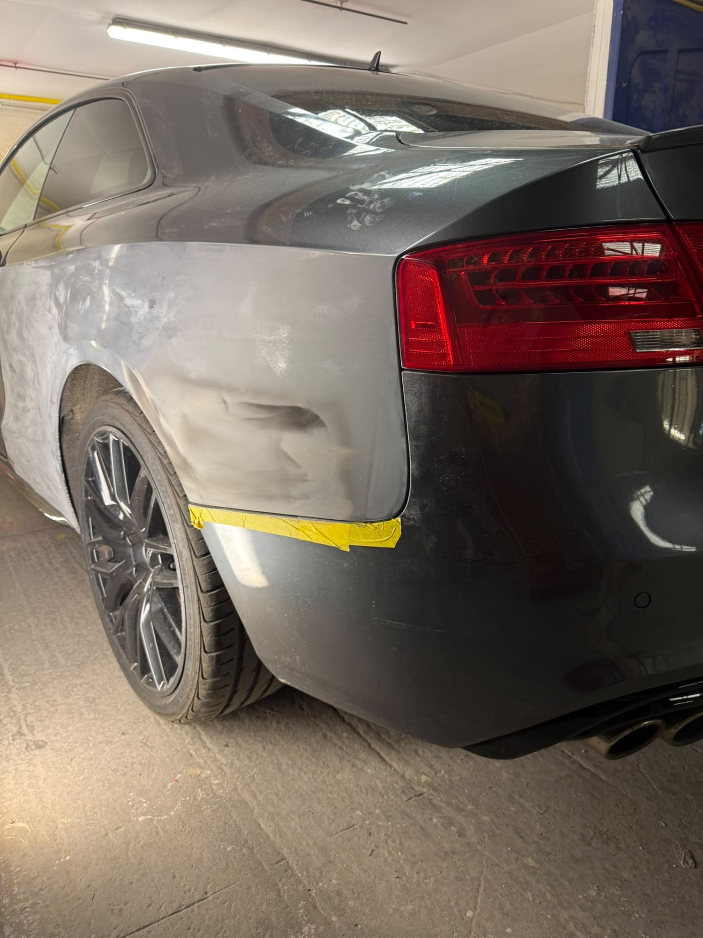 Before 3 — Audi bodywork shown through damage repair, preparation, masking, primer and paintwork.